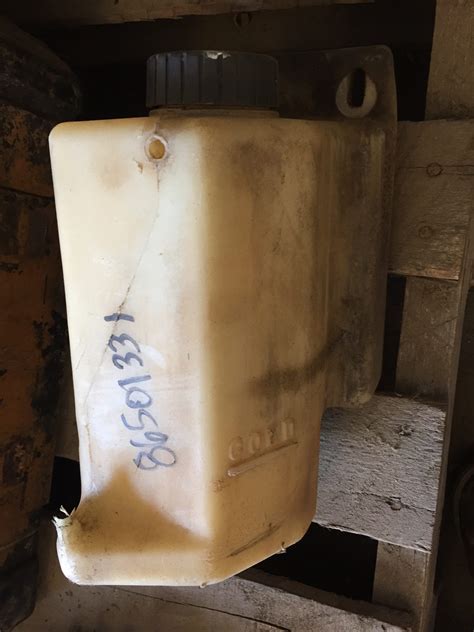 newholland lk665 skid steer coolant recovery tank|86501331 New Holland RESERVOIR, COOLANT E .